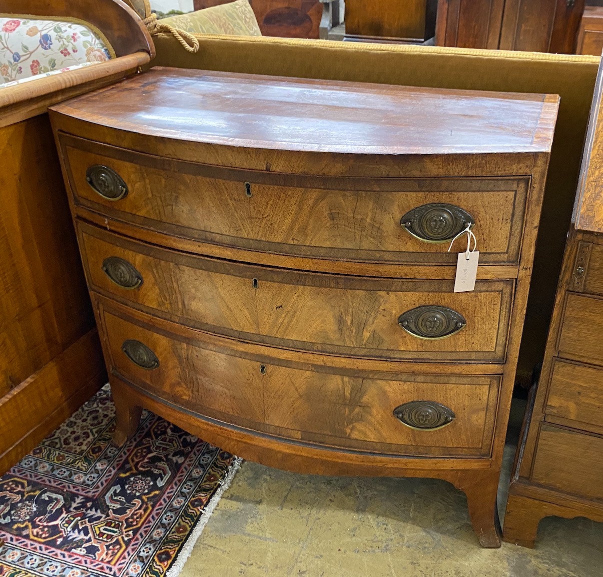 A small Regency banded mahogany three drawer chest, width 90cm, depth 47cm, height 82cm